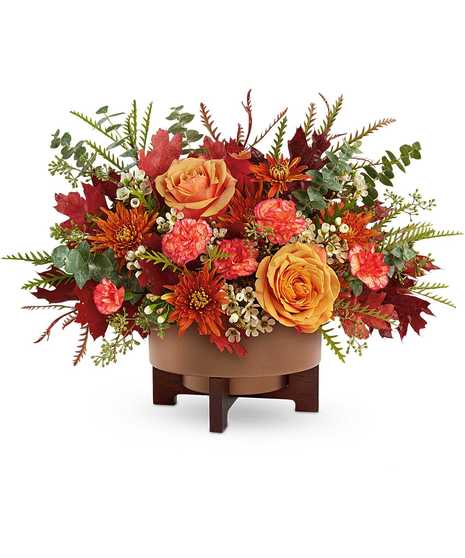 Modern Copper Centerpiece with orange roses, bronze chrysanthemums, carnations, and eucalyptus in a copper planter with stand