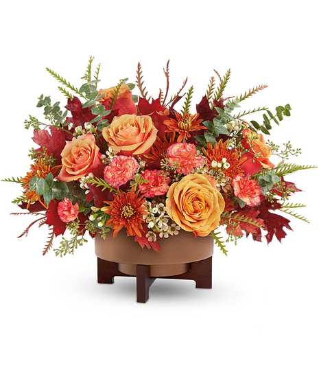 Modern Copper Centerpiece with orange roses, bronze chrysanthemums, carnations, and eucalyptus in a copper planter with stand